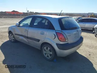 2009 Kia Rio LX with VIN KNADE243596530314, listed as a IAAI auction lot 41681050 with 114,831 mi miles. Bid and sale history available at carsss.com. Image 3.