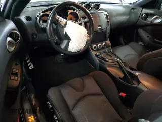 2009 Nissan 370Z z VIN JN1AZ44EX9M407193, wystawiony jako Copart lot #84891734 z przebiegiem 129 296 mil mil oraz Szkoda całkowita • Salvage title. Historia ofert i sprzedaży dostępna na DreamBid. Obrazek 8.