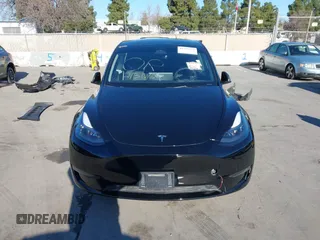 2024 Tesla Model Y Long Range with VIN 7SAYGDEEXRF983040, listed as a IAAI auction lot 41555332 with 79,506 mi miles and . Bid and sale history available at DreamBid. Image 12.