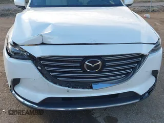2016 Mazda CX-9 Grand Touring z VIN JM3TCADY4G0124588, wystawiony jako IAAI lot #41192549 z przebiegiem 161 272 mil mil oraz . Historia ofert i sprzedaży dostępna na DreamBid. Obrazek 6.