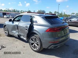 2021 Audi Q8 Premium Plus z VIN WA1EVAF15MD035056, wystawiony jako IAAI lot #41534412 z przebiegiem 65 579 mil mil oraz . Historia ofert i sprzedaży dostępna na DreamBid. Obrazek 3.