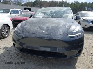 2025 Tesla Model Y Long Range with VIN 7SAYGDED3SA352138, listed as a IAAI auction lot 41760798 with 1,209 mi miles and . Bid and sale history available at DreamBid. Image 11.