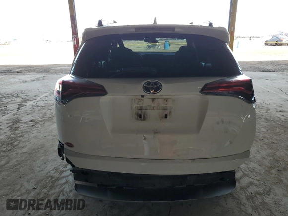 2018 Toyota RAV4 XLE with VIN JTMWFREV2JJ740145, listed as a Copart auction lot 52214075 with 129,940 mi miles and Salvage title. Bid and sale history available at DreamBid. Image 6.