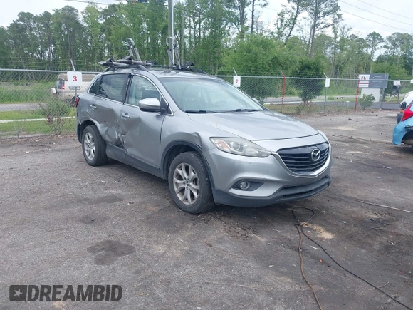 2015 Mazda CX-9 Touring z VIN JM3TB2CA1F0455916, wystawiony jako IAAI lot #42226924 z przebiegiem 157 643 mil mil oraz . Historia ofert i sprzedaży dostępna na DreamBid. Obrazek 1.