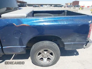 2004 Dodge 1500 SLT with VIN 1D7HA18N04J144868, listed as a IAAI auction lot 41870559 with 157,379 mi miles. Bid and sale history available at carsss.com. Image 6.