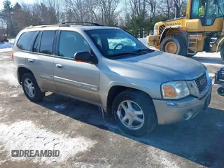 2002 GMC Envoy SLT with VIN 1GKDT13S822154592, listed as a IAAI auction lot 41389285 with 153,897 mi miles. Bid and sale history available at carsss.com. Image 1.