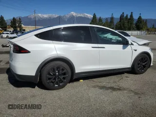 2023 Tesla Model X with VIN 7SAXCDE52PF378496, listed as a Copart auction lot 49455825 with Not Provided miles and Salvage Title. Bid and sale history available at DreamBid. Image 3.