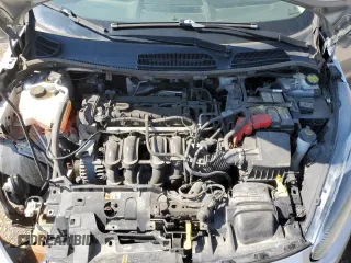 2015 Ford Fiesta SE z VIN 3FADP4EJ0FM212740, wystawiony jako Copart lot #63944573 z przebiegiem 123 037 mil mil oraz Szkoda całkowita • Salvage title. Historia ofert i sprzedaży dostępna na DreamBid. Obrazek 11.