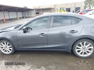 2014 Mazda 3 S Touring with VIN JM1BM1V31E1132448, listed as a IAAI auction lot 41815085 with 144,705 mi miles and . Bid and sale history available at DreamBid. Image 14.