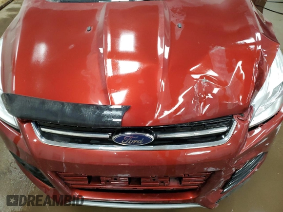 2016 Ford Escape Titanium with VIN 1FMCU9J95GUC57205, listed as a Copart auction lot 71033934 with 90,477 mi miles and Salvage Title. Bid and sale history available at DreamBid. Image 12.