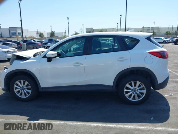 2016 Mazda CX-5 Sport with VIN JM3KE2BY9G0825285, listed as a IAAI auction lot 41841833 with 96,915 mi miles. Bid and sale history available at carsss.com. Image 14.