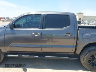 2021 Toyota Tacoma SR with VIN 3TYAX5GN3MT015565, listed as a IAAI auction lot 42241436 with 46,921 mi miles and . Bid and sale history available at DreamBid. Image 14.