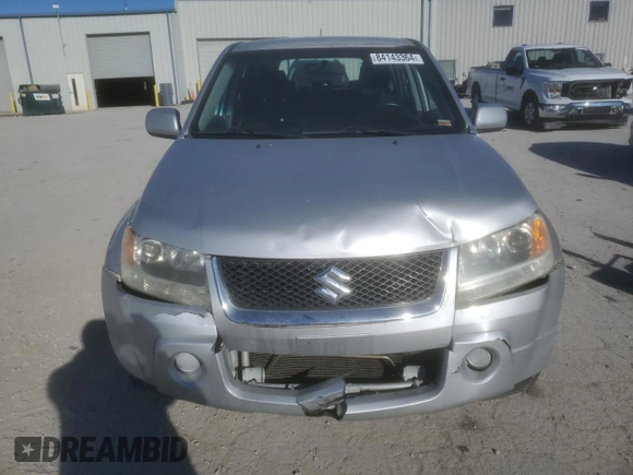 2006 Suzuki Grand Vitara z VIN JS3TE941364101882, wystawiony jako Copart lot #84143364 z przebiegiem 148 560 mil mil oraz Szkody całkowita. Historia ofert i sprzedaży dostępna na DreamBid. Obrazek 5.
