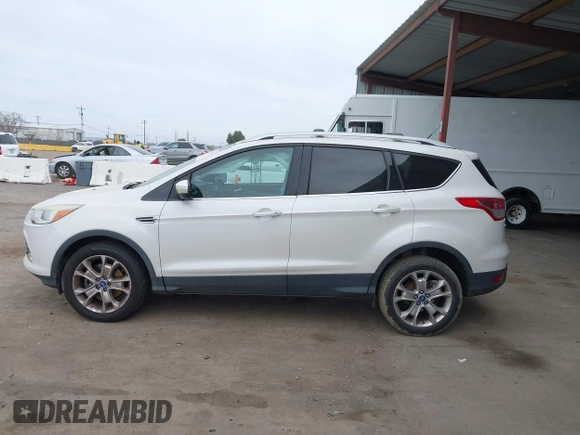 2013 Ford Escape SEL with VIN 1FMCU0H99DUB83641, listed as a IAAI auction lot 41578882 with 124,872 mi miles. Bid and sale history available at carsss.com. Image 14.
