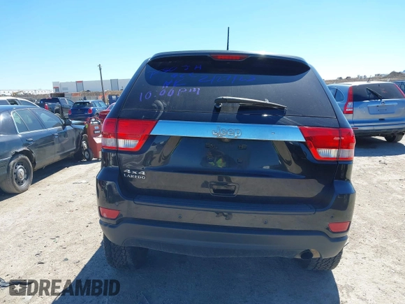 2013 Jeep Grand Cherokee Laredo with VIN 1C4RJFAG2DC643926, listed as a IAAI auction lot 41723575 with 125,048 mi miles. Bid and sale history available at carsss.com. Image 16.