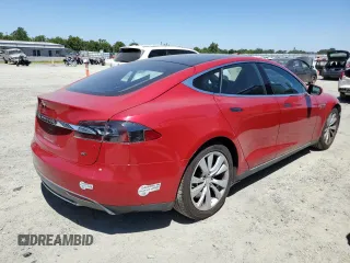 2014 Tesla Model S 60 with VIN 5YJSA1H17EFP64266, listed as a Copart auction lot 61678485 with 104,160 mi miles and Salvage title. Bid and sale history available at DreamBid. Image 3.