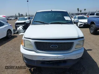 2000 Ford F-150 XL with VIN 1FTRX17L2YNA03263, listed as a IAAI auction lot 42326528 with Not provided miles and . Bid and sale history available at DreamBid. Image 12.