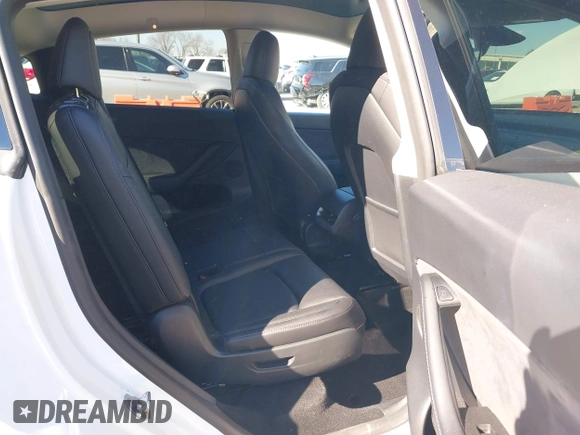 2023 Tesla Model Y Long Range with VIN 7SAYGAEE1PF828338, listed as a IAAI auction lot 40978725 with Not Provided miles and . Bid and sale history available at DreamBid. Image 8.