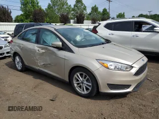 2017 Ford Focus SE z VIN 1FADP3F24HL291870, wystawiony jako Copart lot #60851275 z przebiegiem 83 334 mil mil oraz Szkoda całkowita • Salvage title. Historia ofert i sprzedaży dostępna na DreamBid. Obrazek 4.