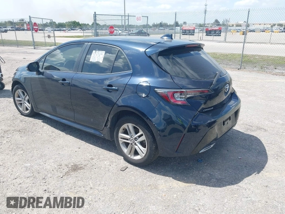 2019 Toyota Corolla Hatchback SE with VIN JTNK4RBE3K3061589, listed as a IAAI auction lot 42123273 with 90,491 mi miles. Bid and sale history available at carsss.com. Image 3.