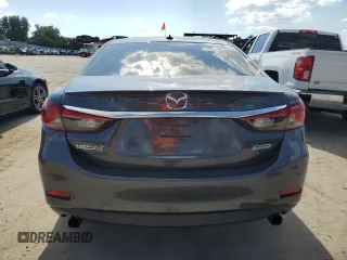 2014 Mazda 6 i Grand Touring с VIN JM1GJ1W67E1135264, выставлен на аукционе Copart как лот 70587624 с пробегом 86 926 миль миль и Списание • Salvage title. История ставок и продаж доступна на DreamBid. Изображение 6.