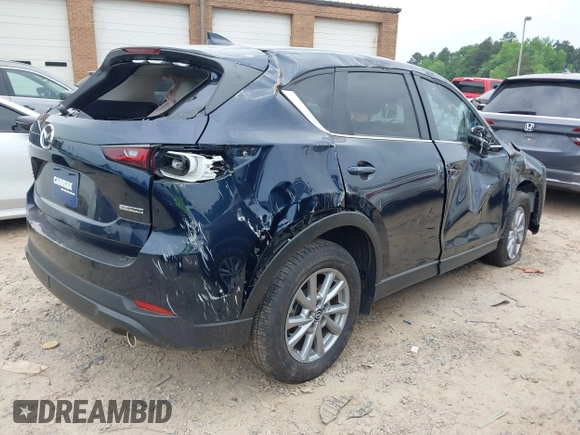 2023 Mazda CX-5 S Carbon Edition z VIN JM3KFBCM6P0251947, wystawiony jako IAAI lot #42286595 z przebiegiem 9 434 mil mil oraz . Historia ofert i sprzedaży dostępna na DreamBid. Obrazek 4.