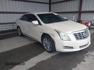 2014 Cadillac XTS Luxury with VIN 2G61M5S31E9210460, listed as a IAAI auction lot 41602087 with 1 mi miles. Bid and sale history available at carsss.com. Image 1.