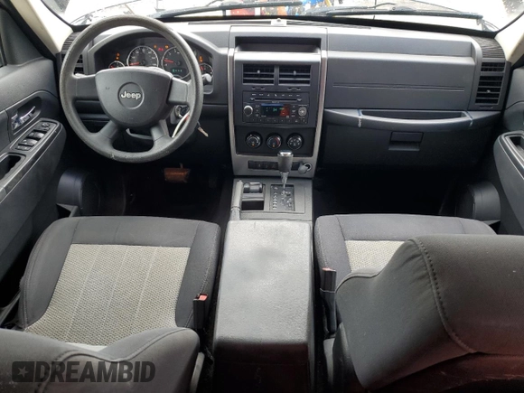 2010 Jeep Liberty Sport with VIN 1J4PN2GK3AW105918, listed as a Copart auction lot 63023885 with 199,366 mi miles and Salvage title. Bid and sale history available at DreamBid. Image 8.