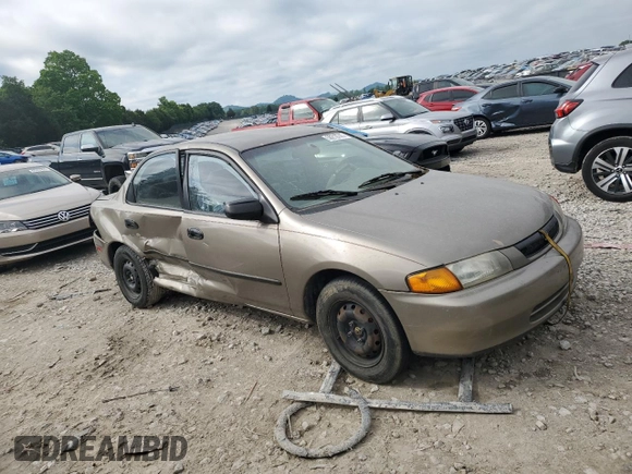 1997 Mazda Protege DX z VIN JM1BC1414V0103244, wystawiony jako Copart lot #56219745 z przebiegiem Nie podano mil oraz Szkoda całkowita • Salvage title. Historia ofert i sprzedaży dostępna na DreamBid. Obrazek 4.
