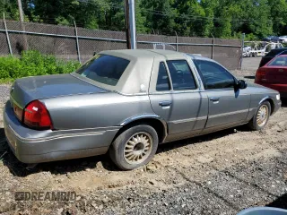 2000 Mercury Grand Marquis LS z VIN 2MEFM75W7YX694301, wystawiony jako Copart lot #57225295 z przebiegiem 141 420 mil mil oraz Szkoda całkowita • Salvage title. Historia ofert i sprzedaży dostępna na DreamBid. Obrazek 3.