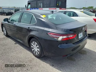 2021 Toyota Camry Hybrid LE with VIN 4T1C31AKXMU554621, listed as a IAAI auction lot 42190615 with 133,190 mi miles. Bid and sale history available at carsss.com. Image 1.