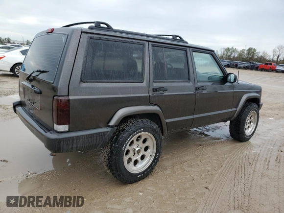 1999 Jeep Cherokee Sport with VIN 1J4FT68S2XL656679, listed as a Copart auction lot 88145875 with 254,038 mi miles and Salvage title. Bid and sale history available at DreamBid. Image 3.