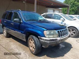 2003 Jeep Grand Cherokee Laredo with VIN 1J4GX48S83C548090, listed as a IAAI auction lot 42039918 with 243,209 mi miles. Bid and sale history available at carsss.com. Image 1.
