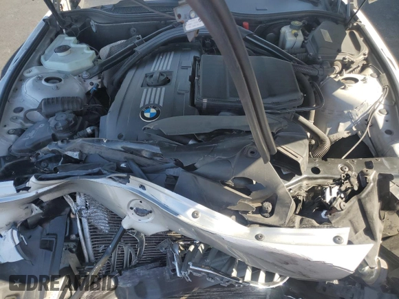 2011 BMW Z4 sDrive35is with VIN WBALM1C54BE633439, listed as a Copart auction lot 60327265 with 112,302 mi miles and Salvage title. Bid and sale history available at DreamBid. Image 11.