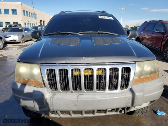 1999 Jeep Grand Cherokee Laredo with VIN 1J4GW58N9XC633464, listed as a Copart auction lot 84682454 with 212,738 mi miles and Salvage Title. Bid and sale history available at carsss.com. Image 5.