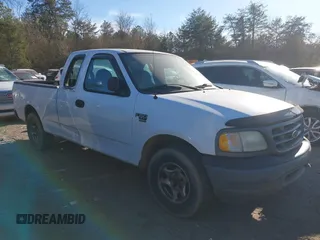 2003 Ford F-150 XL with VIN 1FTRX17W33NA66469, listed as a IAAI auction lot 41677909 with 236,619 mi miles. Bid and sale history available at carsss.com. Image 6.