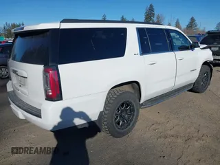 2019 GMC Yukon XL SLE z VIN 1GKS2FKC9KR147823, wystawiony jako IAAI lot #41571738 z przebiegiem 95 764 mil mil oraz . Historia ofert i sprzedaży dostępna na DreamBid. Obrazek 4.