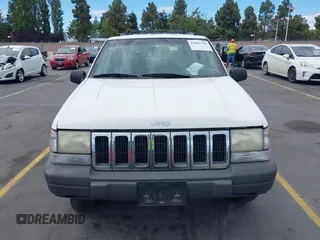 1996 Jeep Grand Cherokee Laredo with VIN 1J4FX58S5TC388512, listed as a IAAI auction lot 42803796 with 147,732 mi miles and . Bid and sale history available at DreamBid. Image 6.