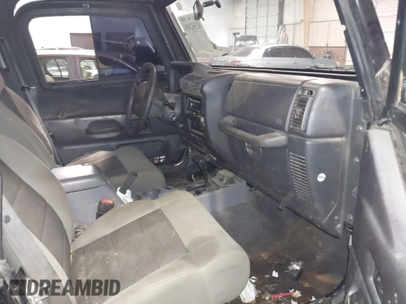 1999 Jeep Wrangler Sahara z VIN 1J4FY49S4XP432567, wystawiony jako IAAI lot #41562455 z przebiegiem Nie podano mil oraz . Historia ofert i sprzedaży dostępna na DreamBid. Obrazek 5.