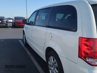 2015 Dodge Grand Caravan American Value with VIN 2C4RDGBG3FR732989, listed as a IAAI auction lot 42175478 with 91,301 mi miles and . Bid and sale history available at DreamBid. Image 1.