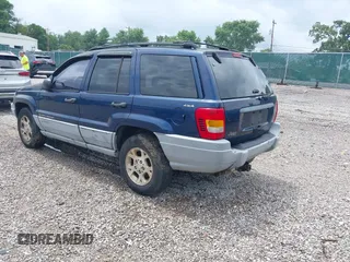 2000 Jeep Grand Cherokee Laredo z VIN 1J4GW48S9YC338947, wystawiony jako IAAI lot #42545830 z przebiegiem 234 251 mil mil oraz . Historia ofert i sprzedaży dostępna na DreamBid. Obrazek 3.