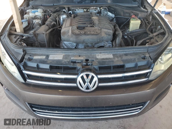 2012 Volkswagen Touareg Exec with VIN WVGEF9BP8CD008665, listed as a Copart auction lot 84611354 with 103,090 mi miles and Salvage Title. Bid and sale history available at DreamBid. Image 12.