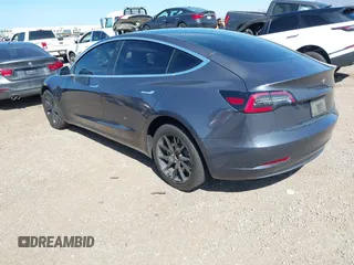 2020 Tesla Model 3 Standard Range Plus with VIN 5YJ3E1EA5LF644282, listed as a IAAI auction lot 41710124 with 69,969 mi miles and . Bid and sale history available at DreamBid. Image 3.