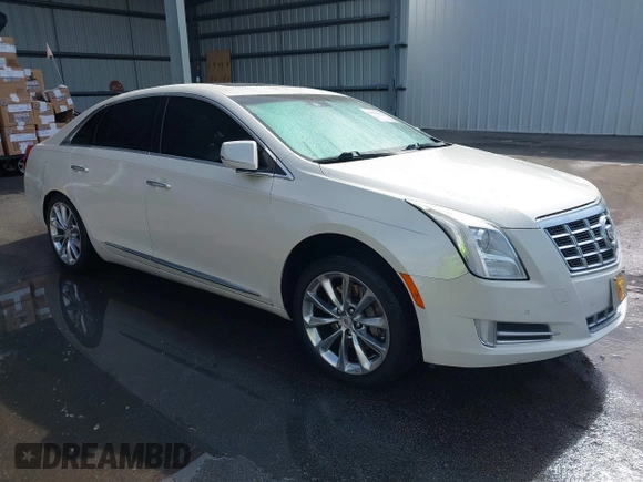 2013 Cadillac XTS Premium z VIN 2G61S5S35D9103948, wystawiony jako IAAI lot #42090444 z przebiegiem 154 728 mil mil oraz . Historia ofert i sprzedaży dostępna na DreamBid. Obrazek 1.