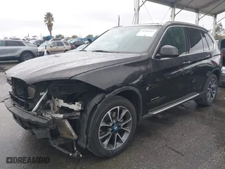 2018 BMW X5 xDrive40e iPerformance with VIN 5UXKT0C54J0V99573, listed as a IAAI auction lot 41490567 with 50,650 mi miles. Bid and sale history available at carsss.com. Image 18.