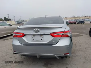 2019 Toyota Camry LE z VIN 4T1B11HK7KU713082, wystawiony jako IAAI lot #42151362 z przebiegiem 93 546 mil mil oraz . Historia ofert i sprzedaży dostępna na DreamBid. Obrazek 17.