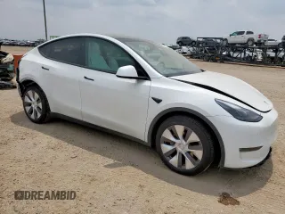 2024 Tesla Model Y Long Range with VIN 7SAYGDEE6RA290124, listed as a Copart auction lot 57662385 with 14,751 mi miles and Salvage title. Bid and sale history available at DreamBid. Image 4.