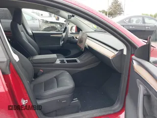 2023 Tesla Model Y Long Range with VIN 7SAYGDEE9PA145947, listed as a IAAI auction lot 42131783 with 4,956 mi miles and . Bid and sale history available at DreamBid. Image 5.