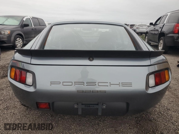 1983 Porsche 928 z VIN WP0ZZZ92ZDS841622, wystawiony jako Copart lot #76995304 z przebiegiem 83 862 mil mil oraz Szkody całkowita. Historia ofert i sprzedaży dostępna na DreamBid. Obrazek 6.