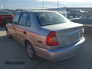 2000 Hyundai Accent z VIN KMHCG45G3YU034438, wystawiony jako IAAI lot #41356583 z przebiegiem 57 283 mil mil oraz . Historia ofert i sprzedaży dostępna na DreamBid. Obrazek 3.